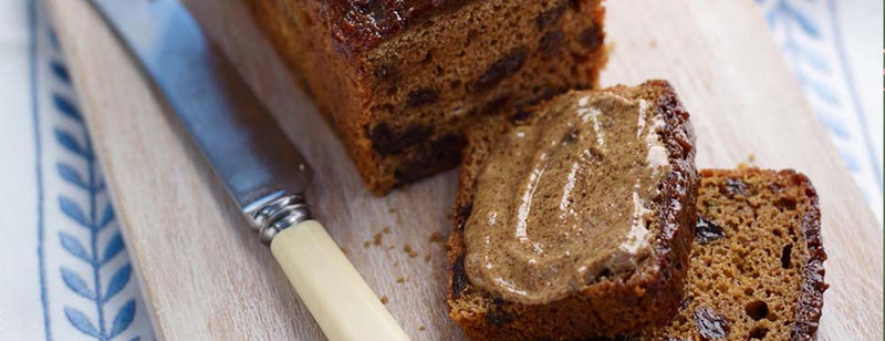 Freshly baked Proper Malt Loaf with a butter knife