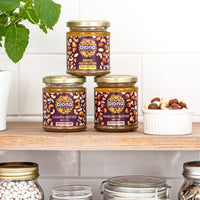 biona nut butters on shelf with bowl of nuts