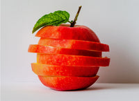 apple cut into pieces and reassembled