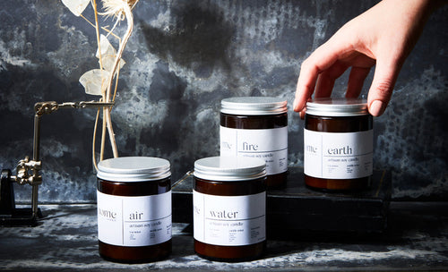 The Home Moment candles with dark background