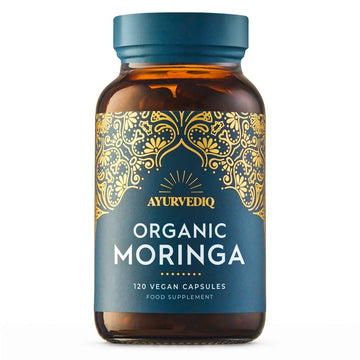 A bottle of Ayurvediq Organic Moringa food supplement, containing 120 vegan capsules.