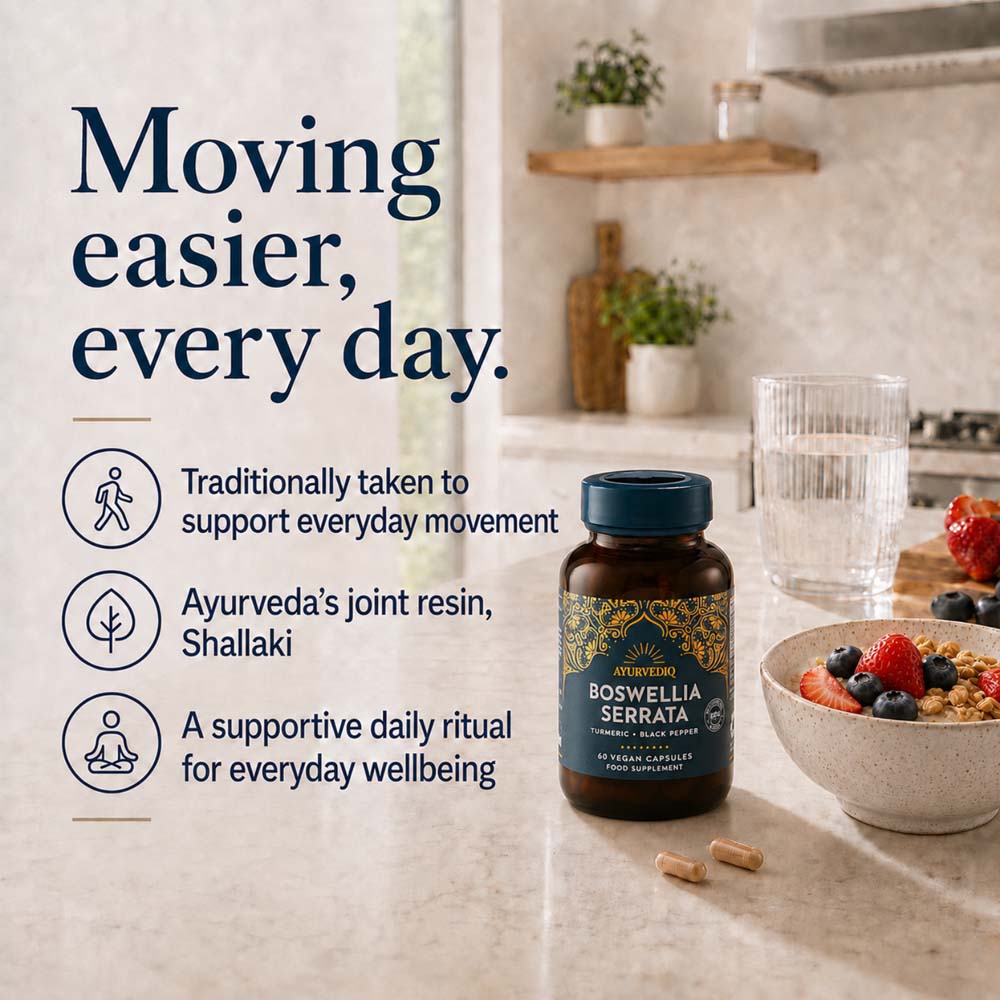 A bottle of Boswellia Serrata dietary supplement placed on a kitchen countertop beside a glass of water, with the informational text &