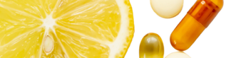 Orange and yellow supplements with slices of lemon