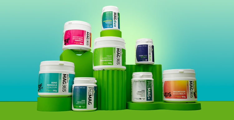 Assorted ITL Health supplement containers on a gradient green and blue background