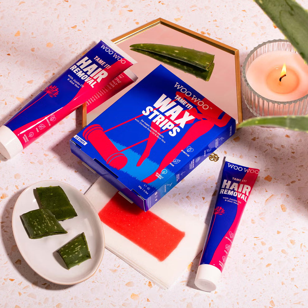Woo Woo hair removal products including wax strips and hair removal cream on a decorative surface.