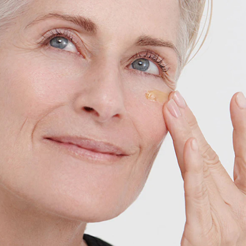 Woman using Dr. Hauschka Regenerating Intensive Eye Serum