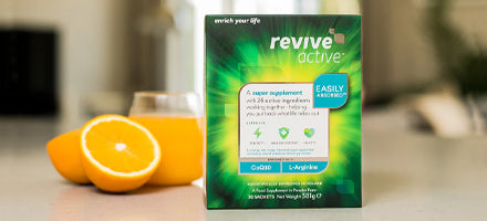 Revive Active supplement box on a kitchen counter with oranges
