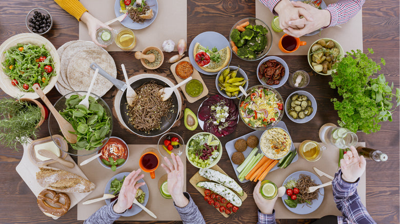 busy dinner table with delicious food
