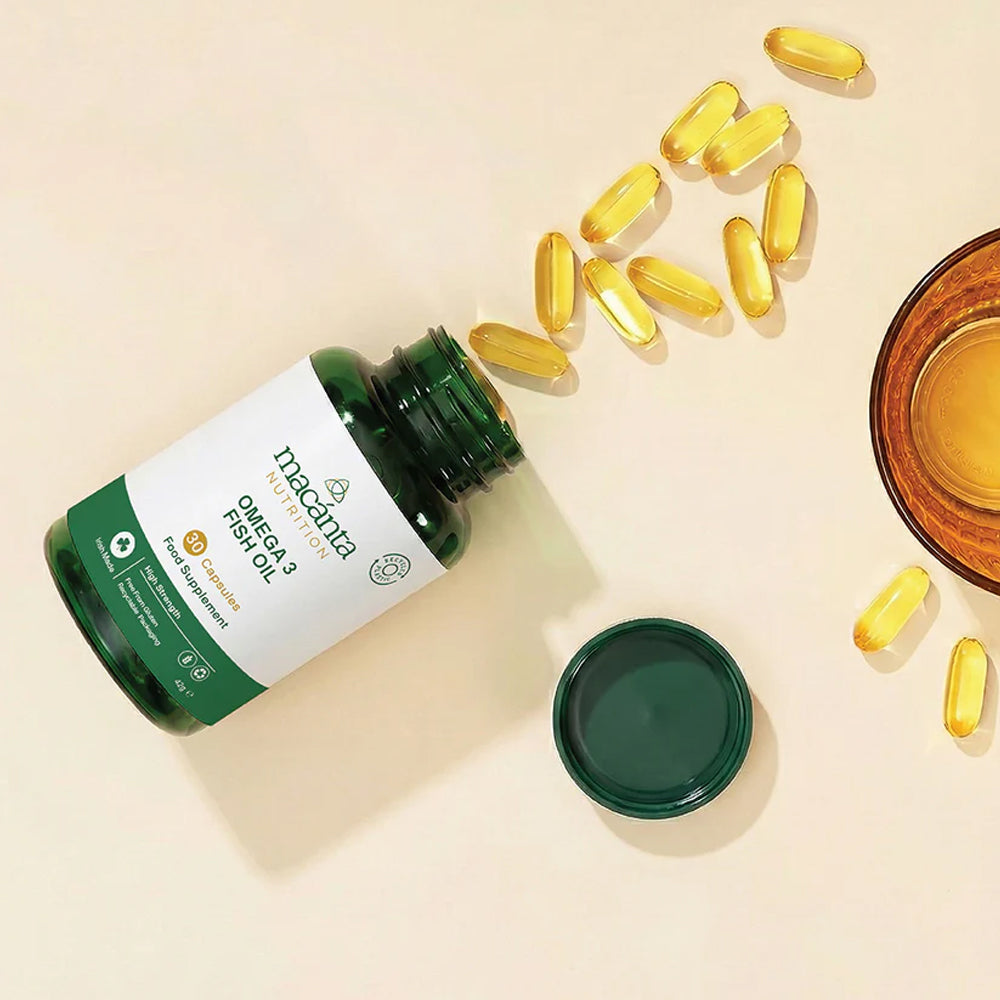 Supplement bottle with fish oil capsules on a beige background