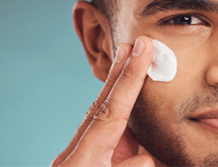 Man applying moisturiser