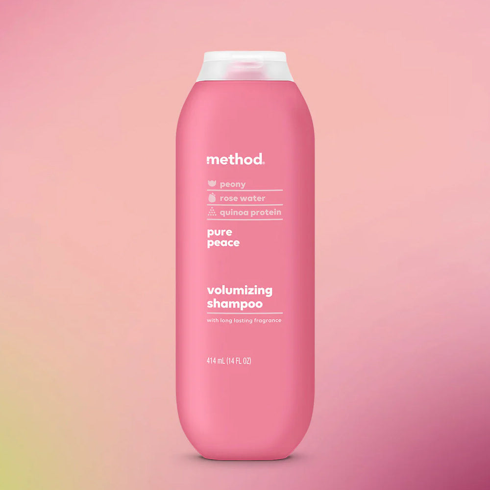 Pink shampoo bottle with &