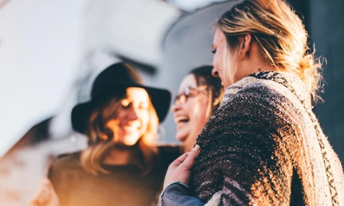 group of women laughing and smiling