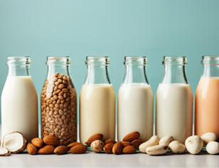 Bottle of different plant milks in a row