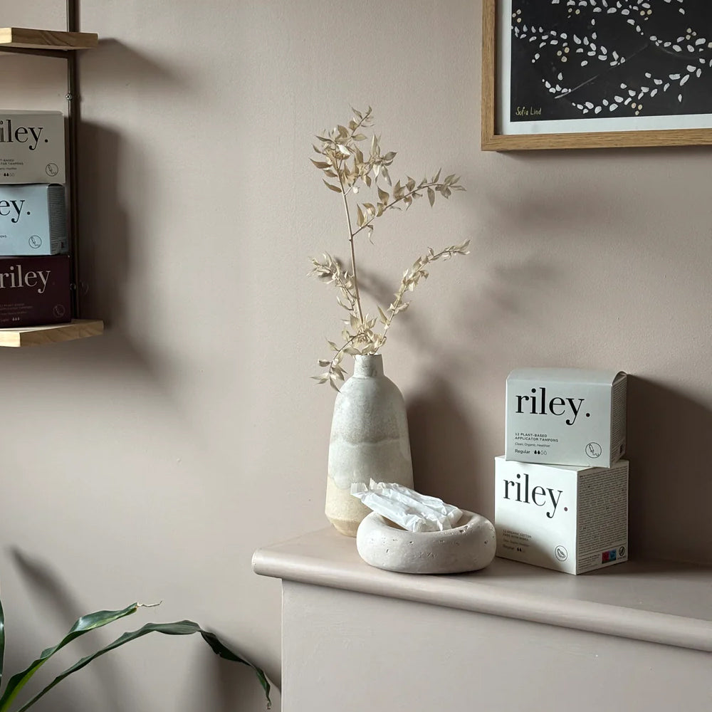 Decorative items on a shelf with &
