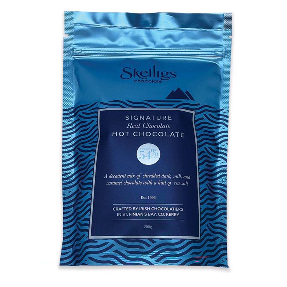 Metalic blue resealable pouch of Skelligs Chocolate Signature Real Hot Chocolate featuring a dark blue label with stylized ocean wave graphics.