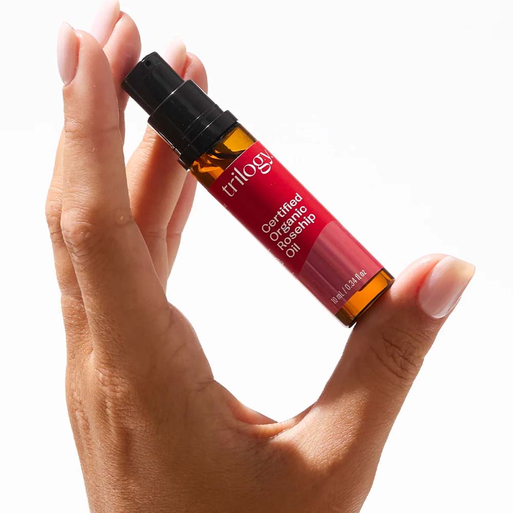 Hand displaying Trilogy Rosehip Oil