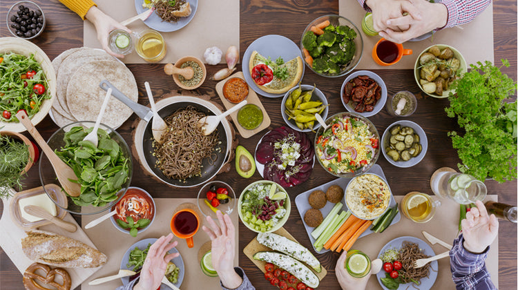 busy dinner table with delicious vegan foods