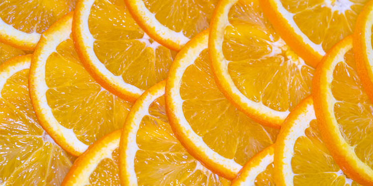 orange slices with serum bottle