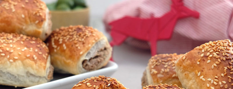 sausage rolls with red reindeer cutout