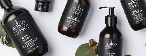 A selection of Sukin for Men skincare with green leafs
