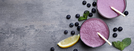 two glasses of acai powder smoothies