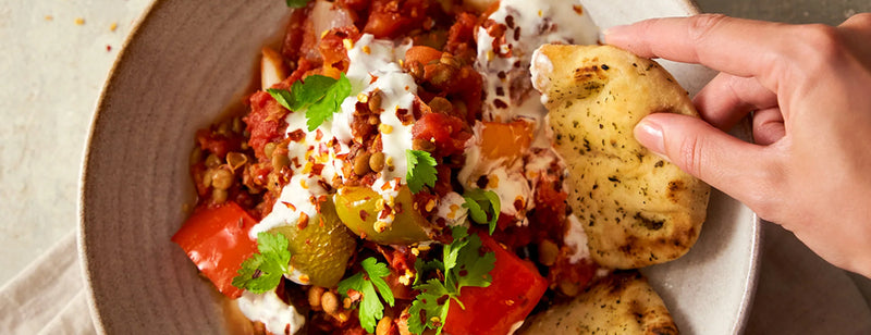 Biona's Quick and Spicy Lentil Ratatouille with Lime Yoghurt with naan bread for dipping