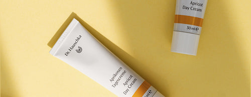Dr. Hauschka Apricot Day Cream with a bright yellow background