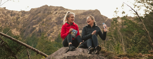 2 girls on a hike drinking G&G kombucha 