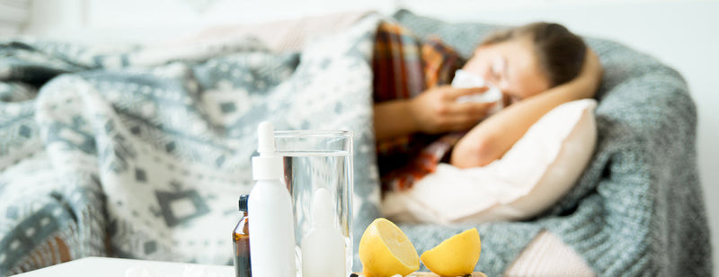 woman sick on the couch with the flu