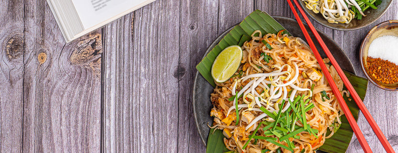 plate of pad thai with chopsticks