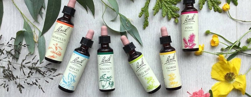 A selection of Bach Original Flower Remedies with flowers