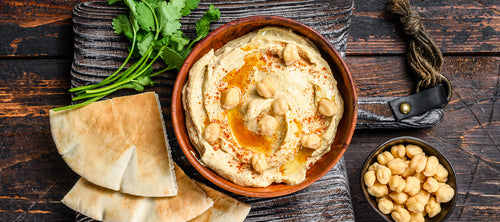 hummus with pitta bread slices