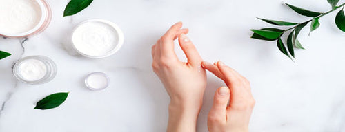 woman using natural and organic beauty products on her hands
