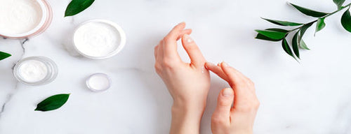 woman using natural and organic beauty products on her hands