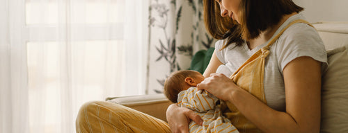 woman breastfeeding new baby