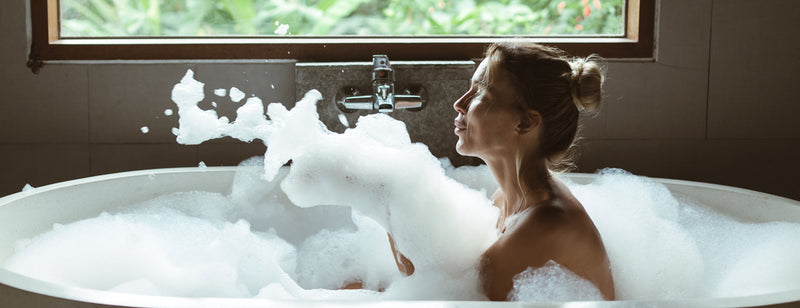 prep you skin for summer - woman in bubble bath