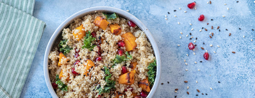 bowl of Quinoa Salad with Pomegranate, kale and butternut squash