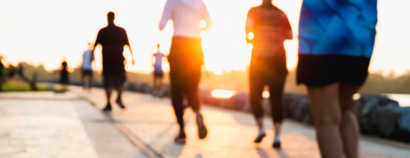 people running by the water 