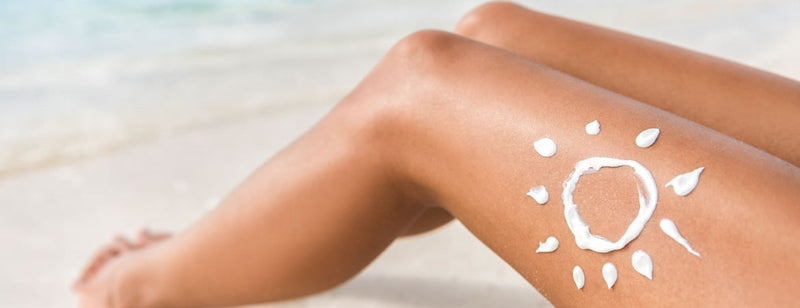 woman wearing sunscreen to stay safe in the sun
