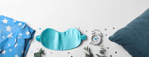 face mask, alarm clock and pyjamas - tools to help you beat insomnia