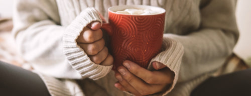 woman with warm drink during the winter season