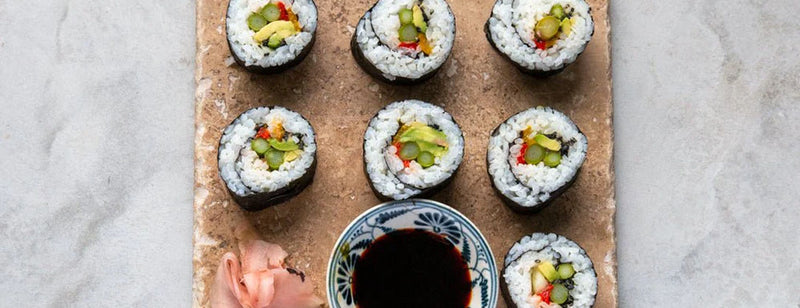 Vegan Maki Roll Rainbow Sushi with soy sauce