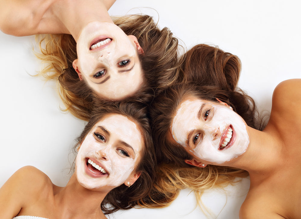 three girls with white face masks