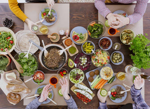 table laid with bowls and plates containing food