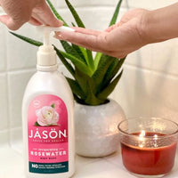 jason rosewater body wash with candle and plant 