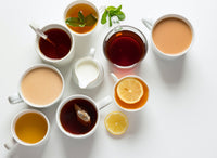 flat lay shot of many cups of tea