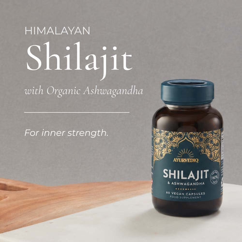 A bottle of Ayurvedic Himalayan Shilajit and Organic Ashwagandha food supplement capsules.