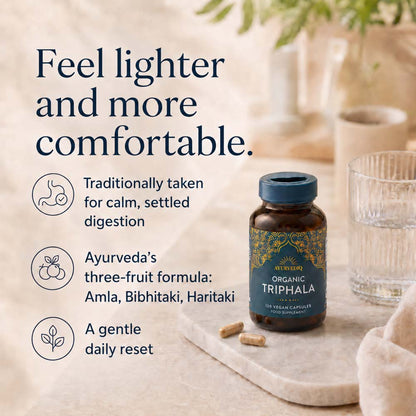 A bottle of All Overly Organic Triphala herbal supplement capsules with text on the left describing its benefits for digestion and calm.