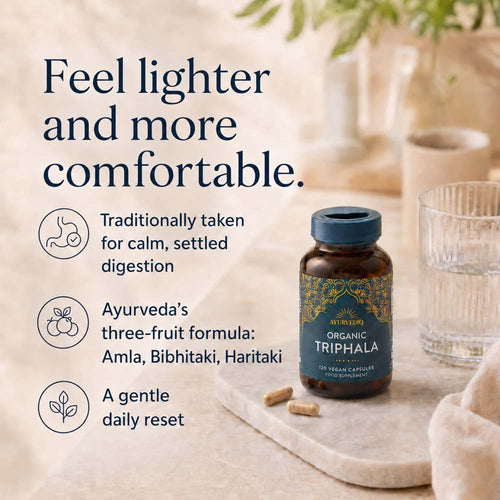 A bottle of All Overly Organic Triphala herbal supplement capsules with text on the left describing its benefits for digestion and calm.