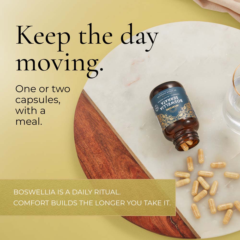 A bottle of Boswellia capsules lies on a white marble board with several capsules scattered. Text reads, &